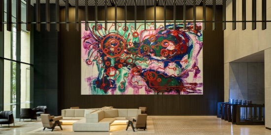 A view of vibrant abstract painting displayed on a wall.